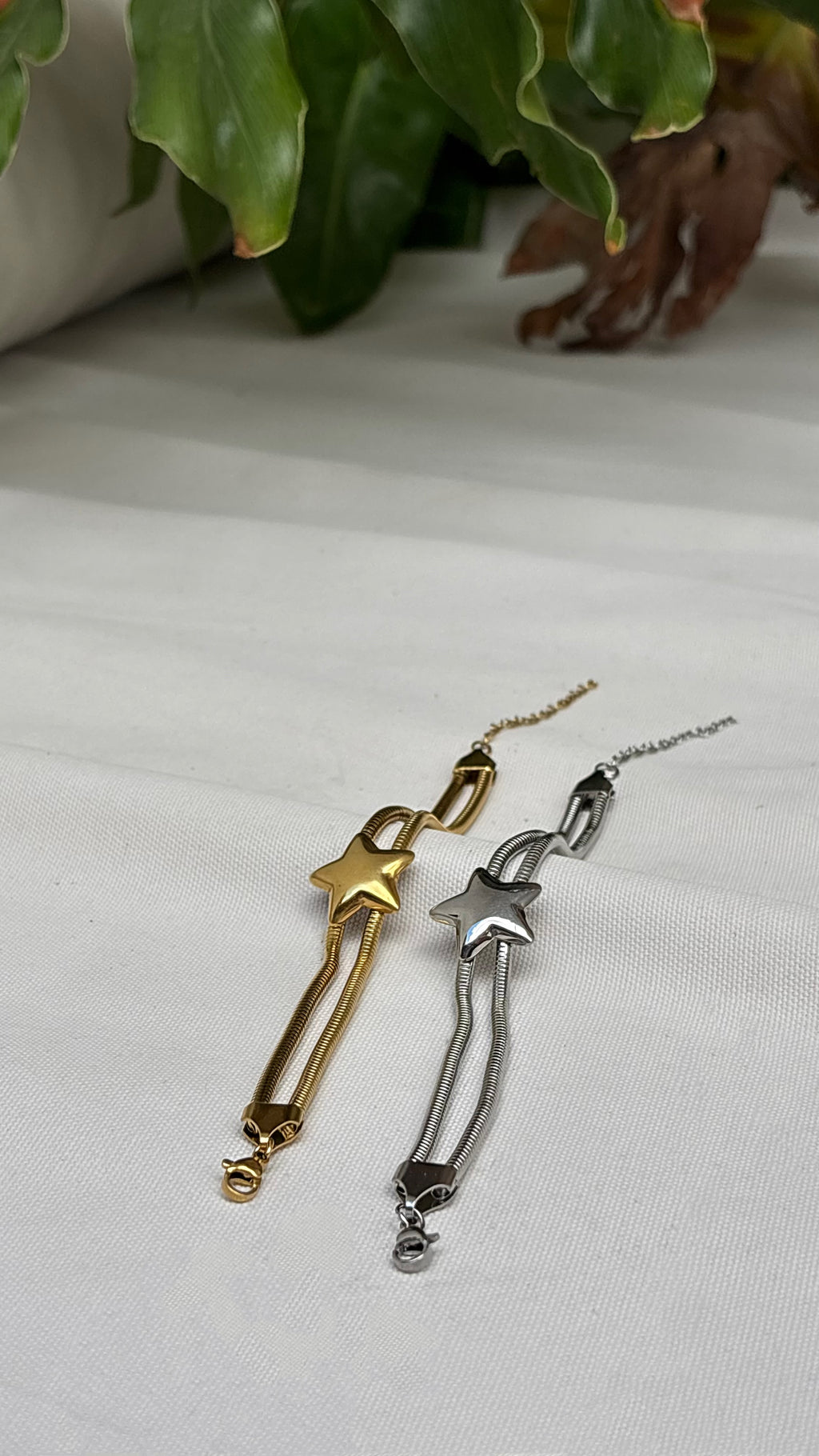 Gold and silver star-shaped bracelets. Hypoallergenic and waterproof by EverLuxe