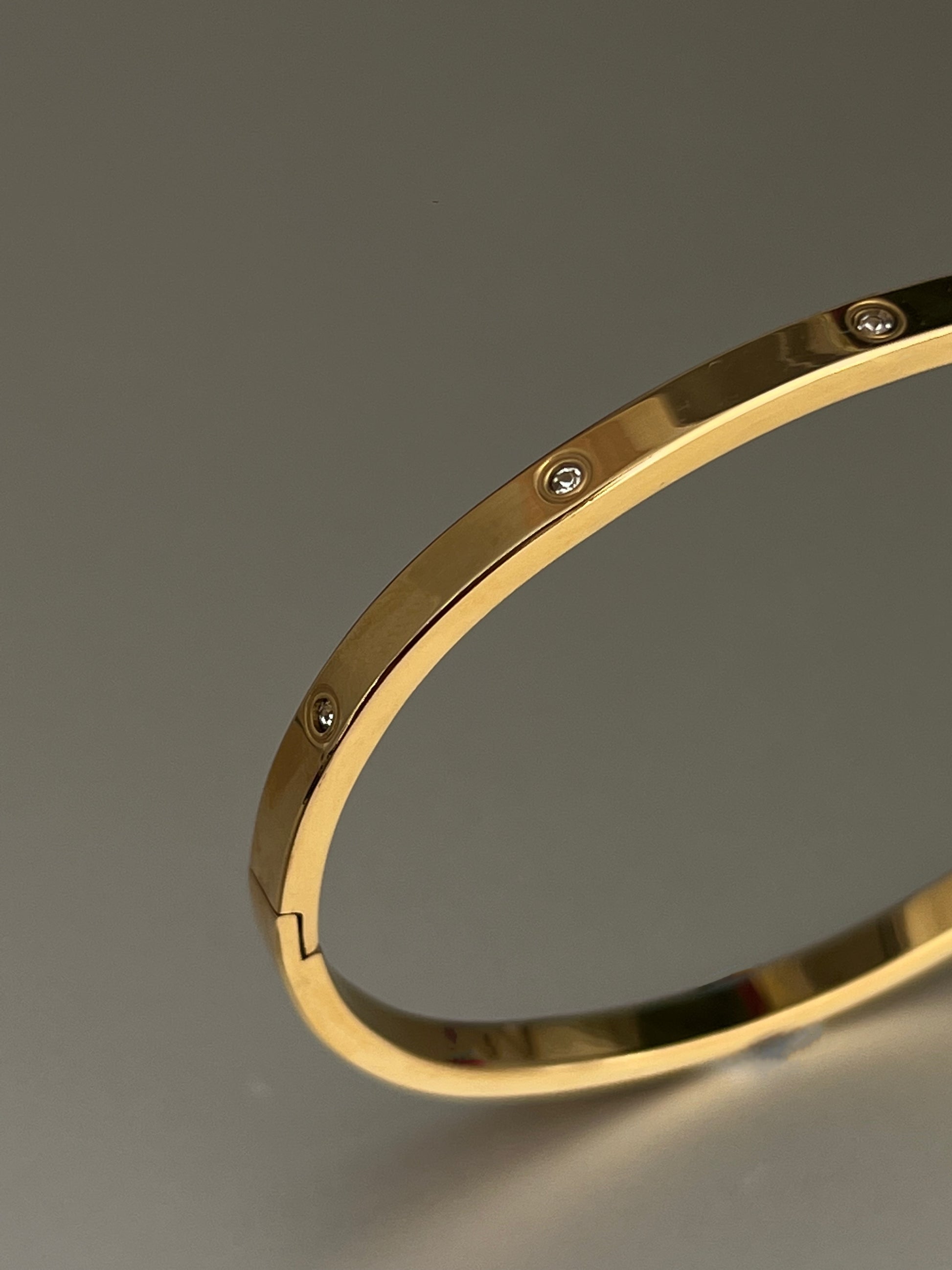 Minimalist gold cuff bracelet worn on wrist – tarnish-resistant and hypoallergenic