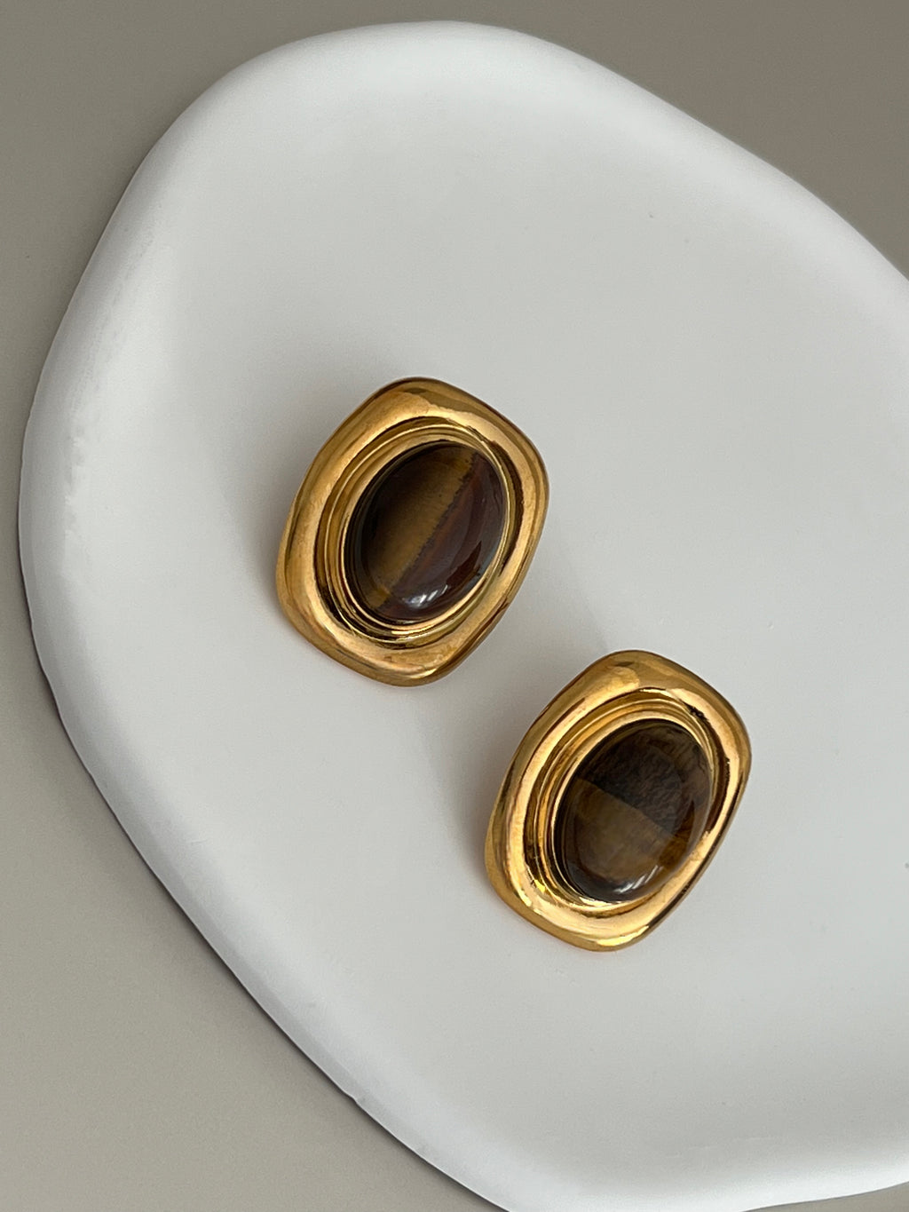 Close-up of Tiger’s Eye luxury earrings