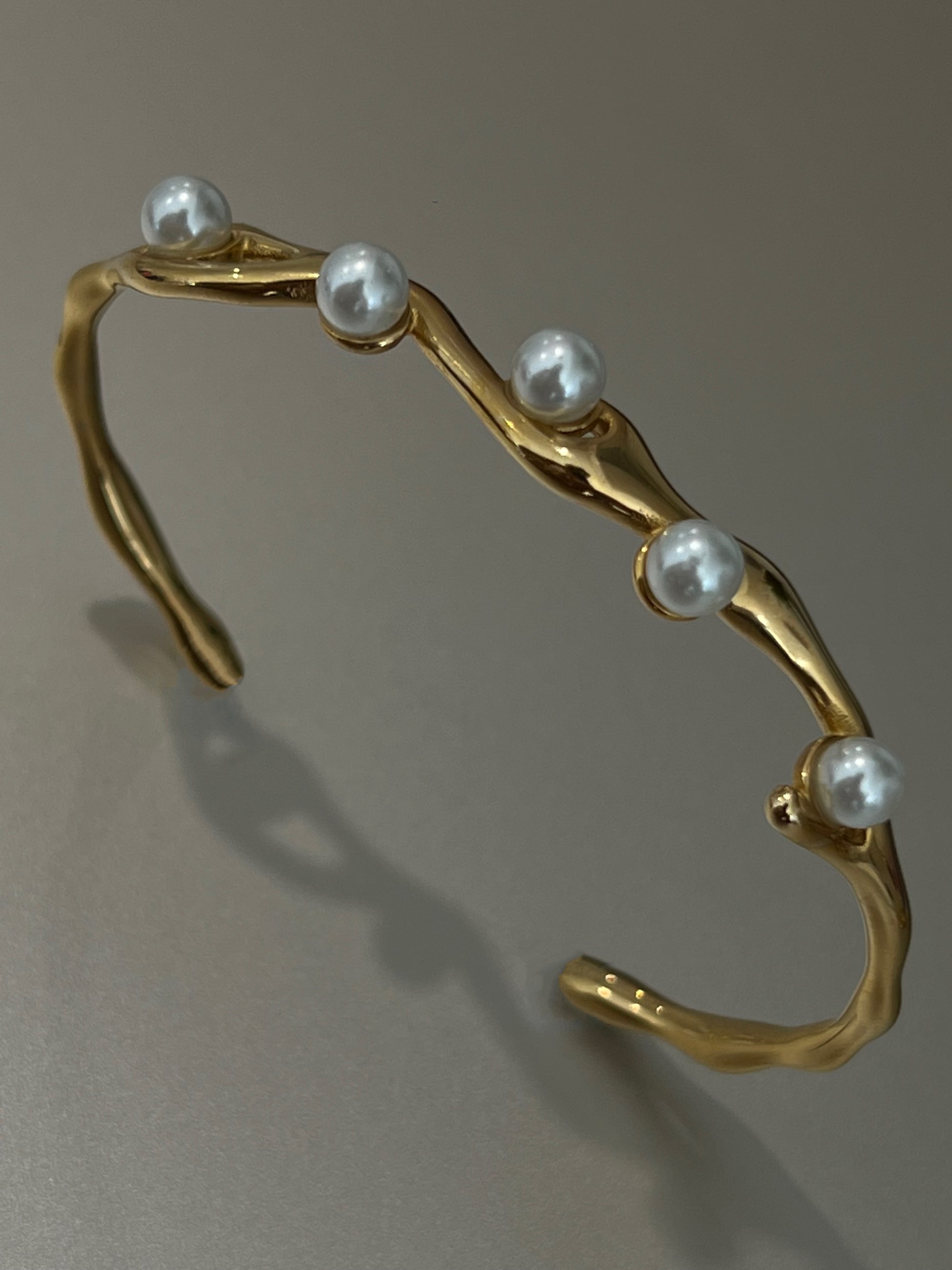 Sol Halo Cuff by EverLuxe. Pearl and Gold bracelet.